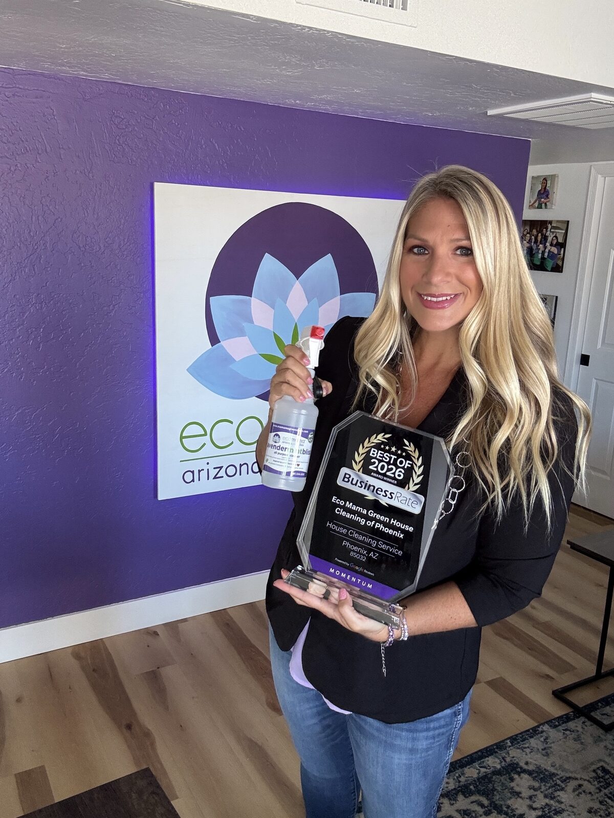 Eco Mama team member cleaning bathroom tile and fixtures in Peoria home