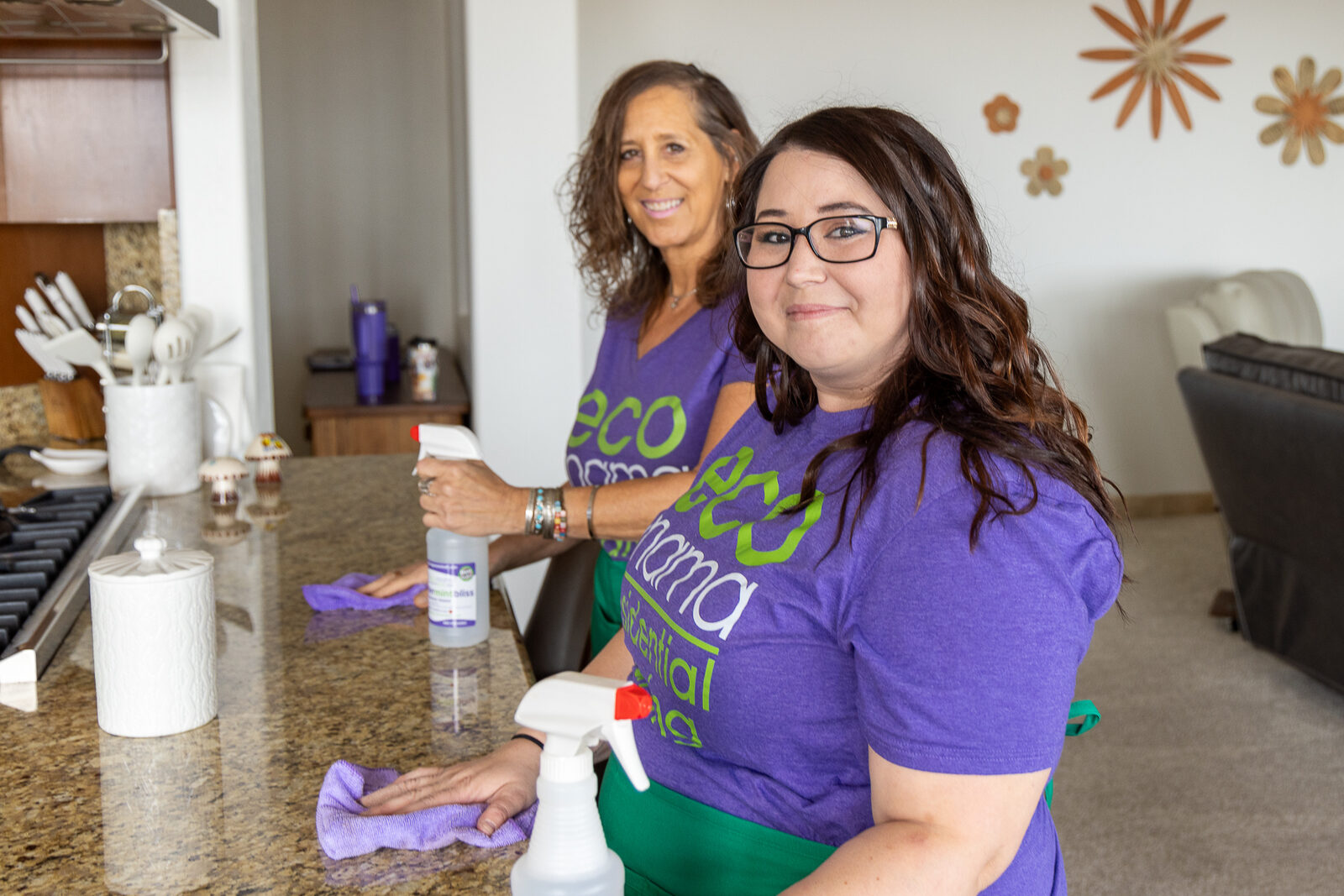 Eco Mama cleaner wiping kitchen counters in a Sun City home with natural cleaning products