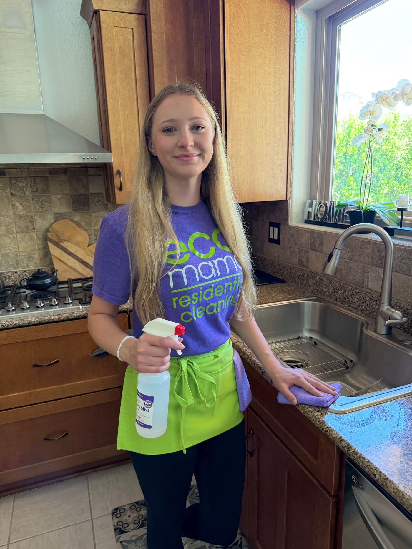 Eco Mama cleaner detailing a kitchen sink during a move-out clean