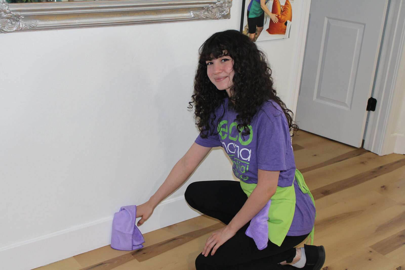 Eco Mama cleaner wiping kitchen counters in a Peoria home using eco-friendly products